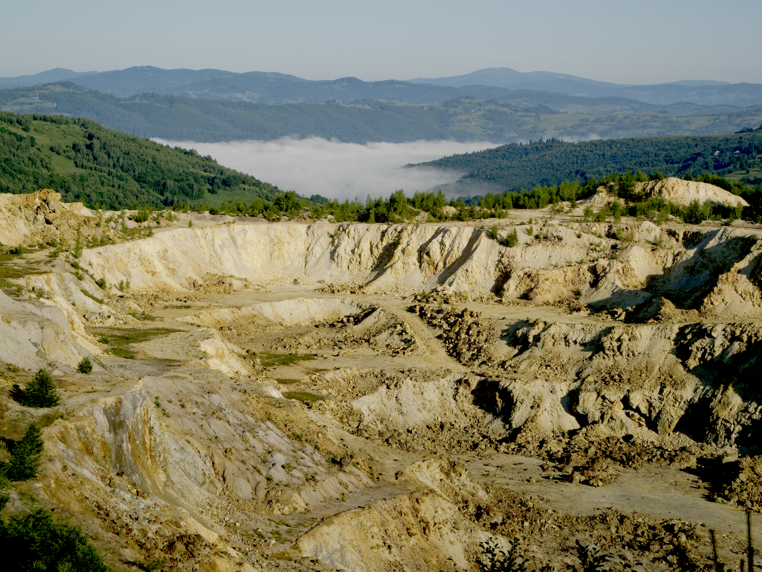 A cetate pit that shows the destruction that open-pit mining creates.